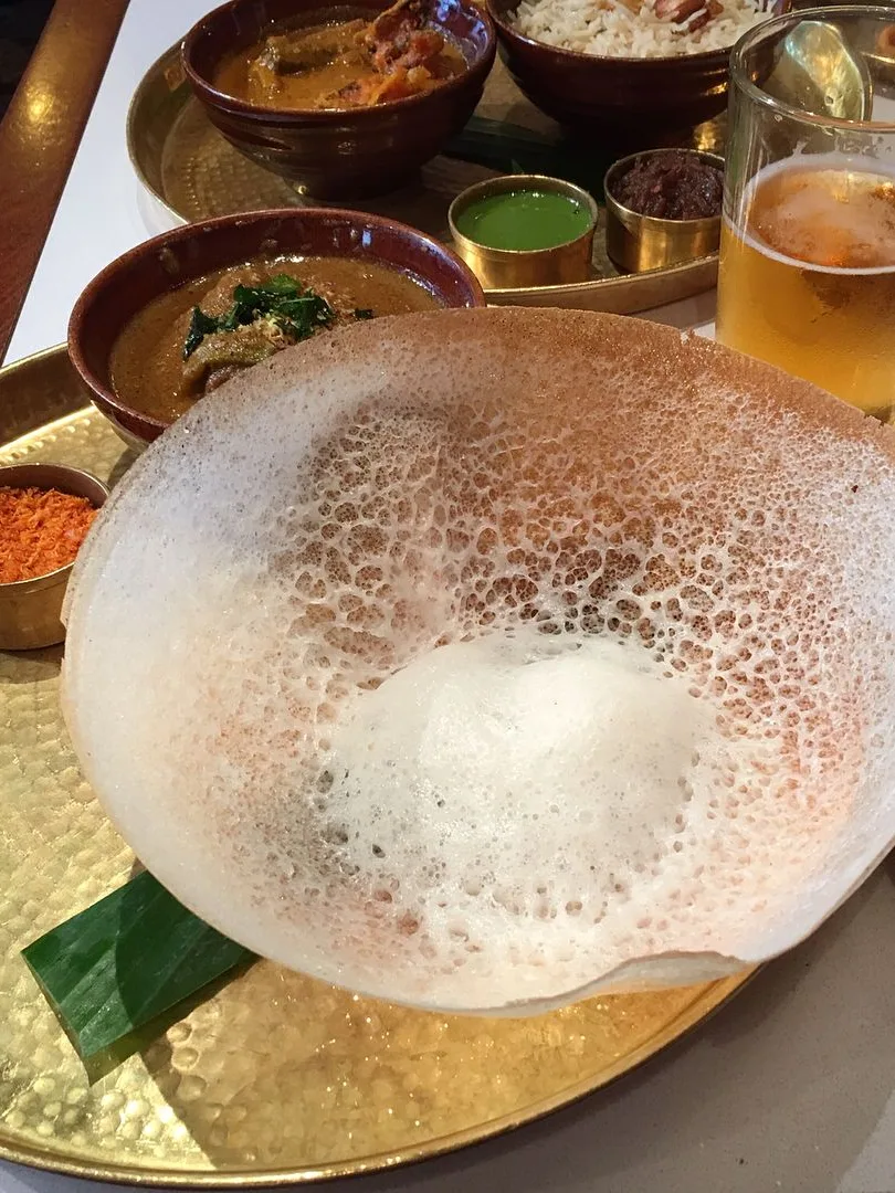 appam: Appam is a thin pancake originating from southern India. It is made with fermented rice batter and coconut milk, traditionally cooked in an appachatti, a deep pan similar in shape to a wok