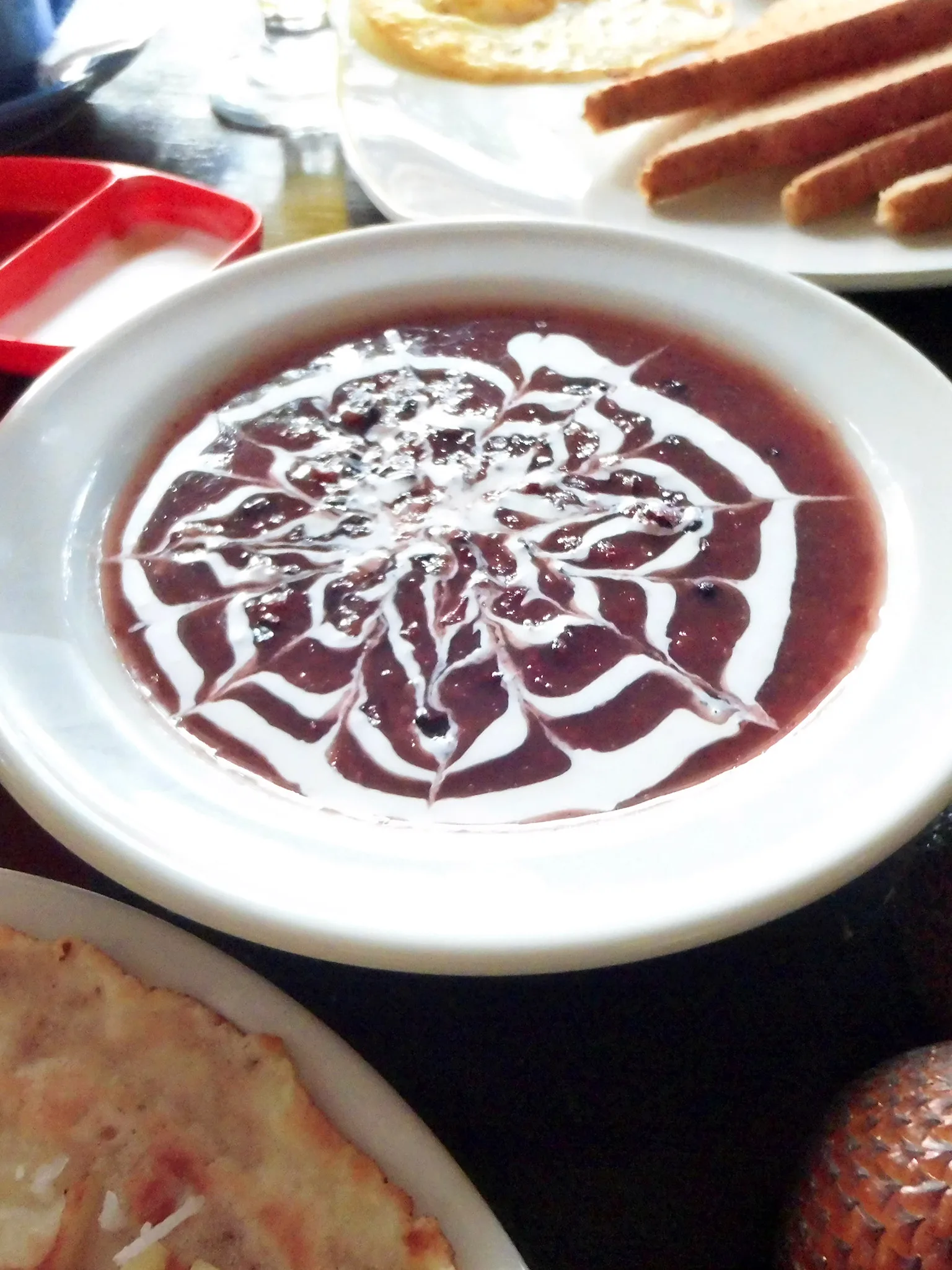 Bubur ketan hitam: Bubur injin is Balinese version of bubur ketan hitam, or sweet black rice pudding served with coconut milk. Served as a breakfast in Gayatri Bungalows, Ubud, Bali, Indonesia