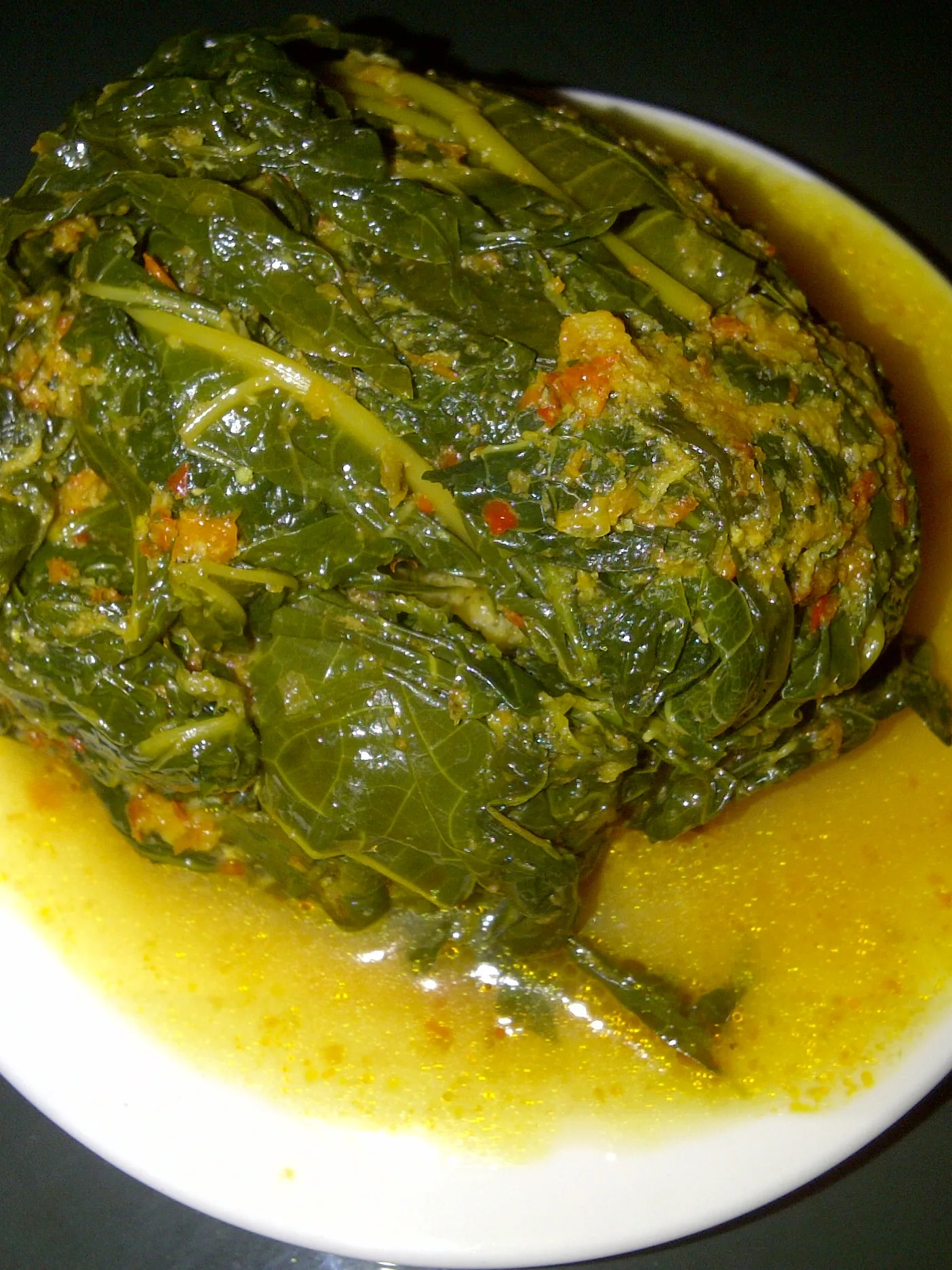 Buntil: Buntil, Javanese traditional food made of papaya leaves which is wraps grated coconut and anchovies and boiled in coconut milk