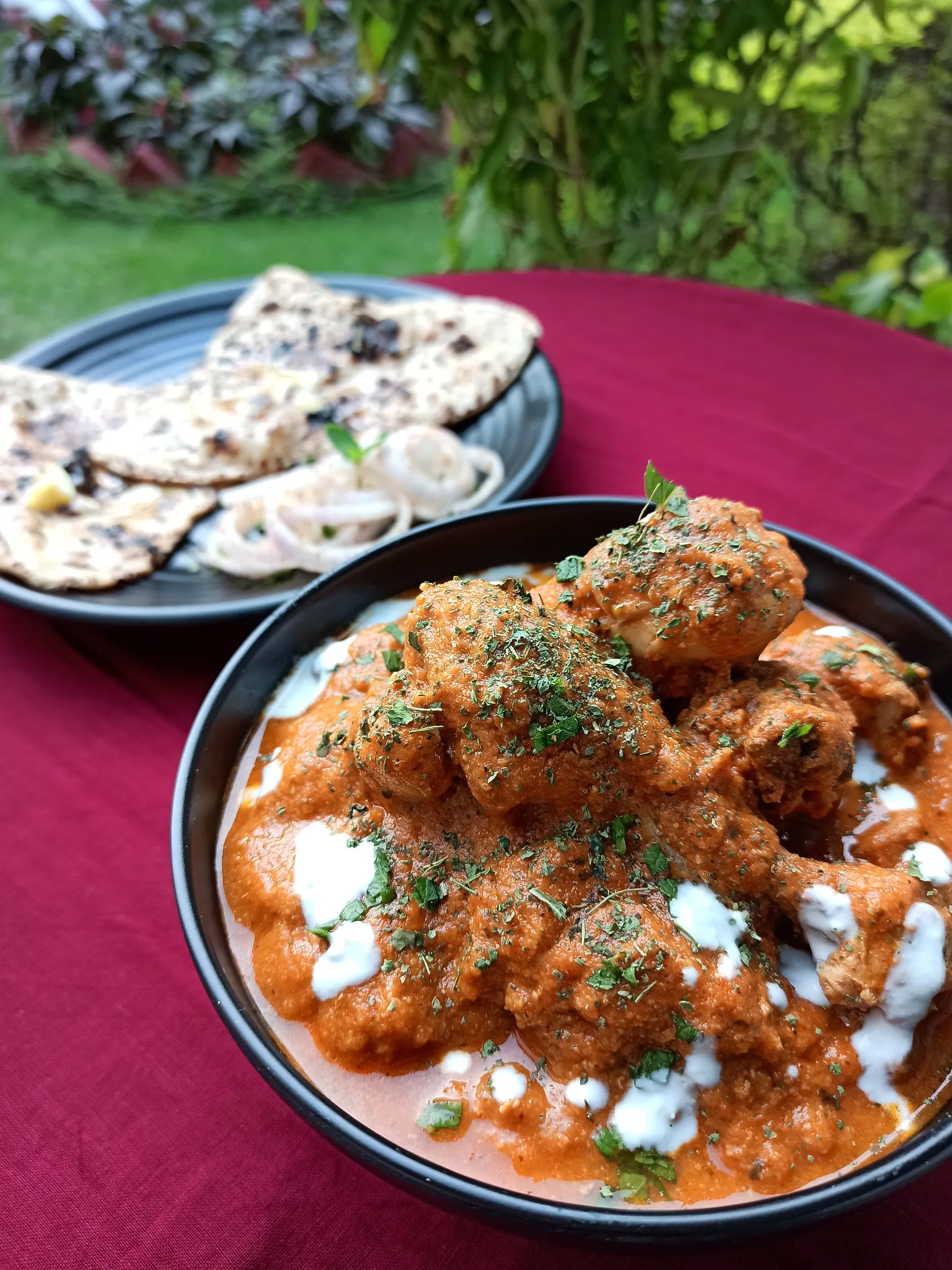 Butter chicken: Homemade butter chicken topped with cream