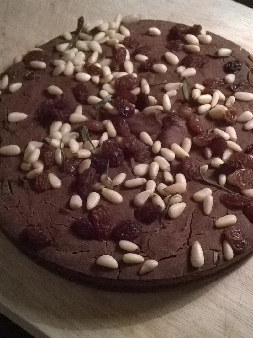 castagnaccio: Castagnaccio with pine nuts and sultanas