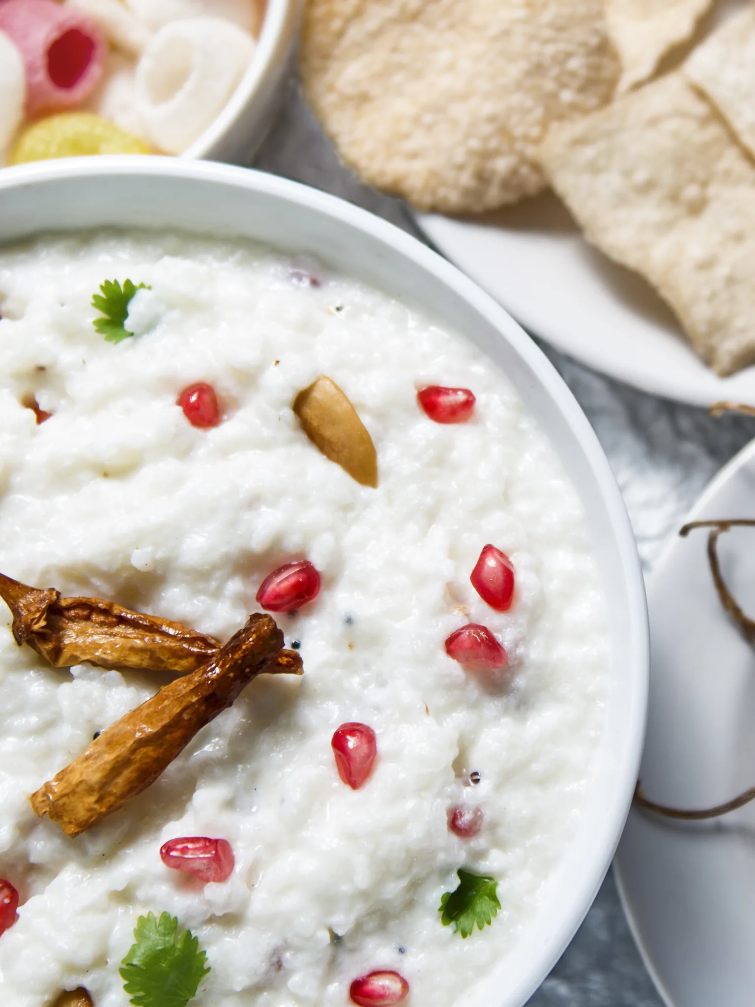 Curd rice: Curd rice with puppads and cashews