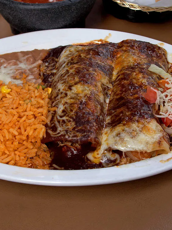 enchilada: Enchilada, rice, and beans