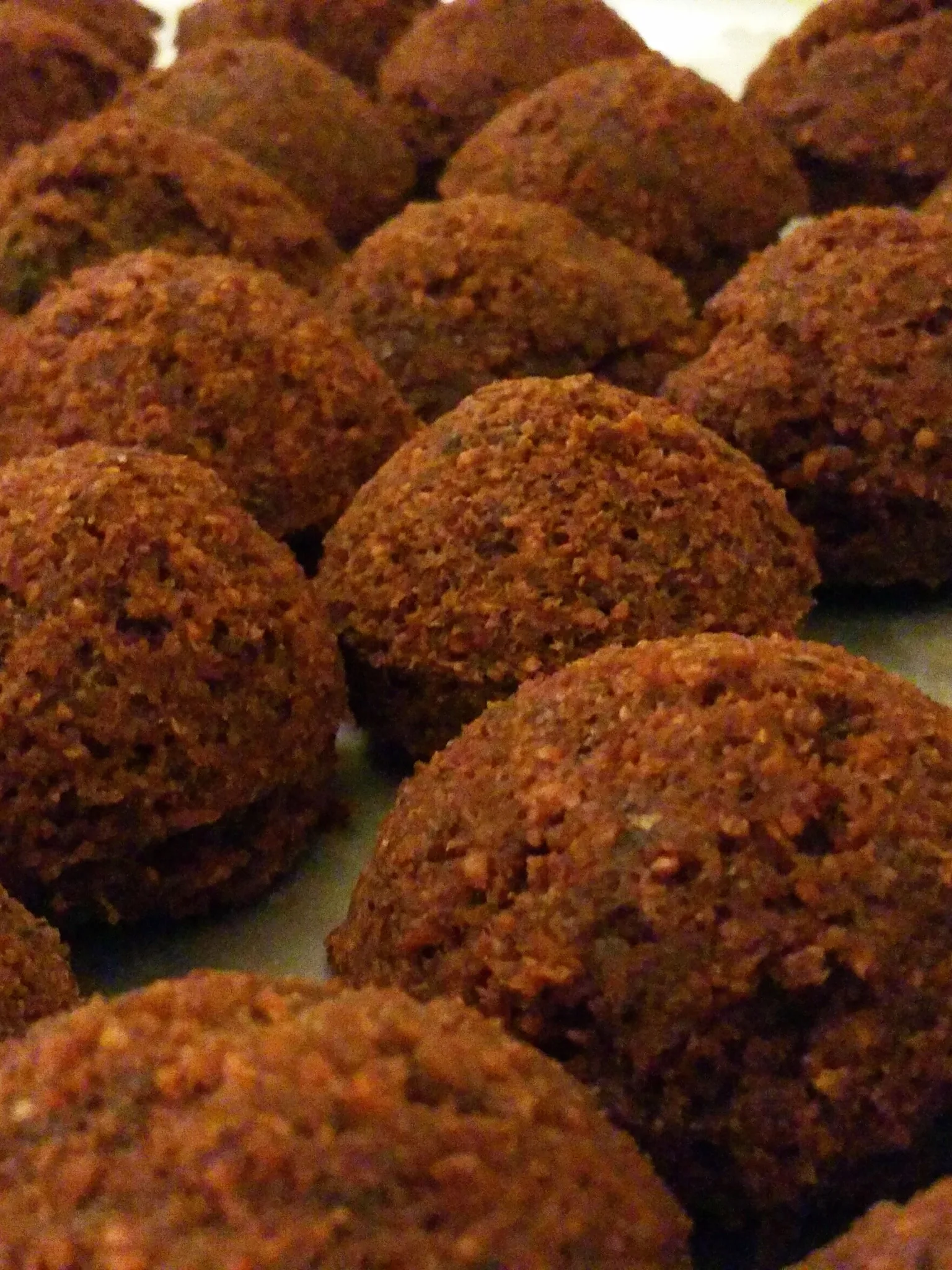 Falafel: Rows of falafels, lebanese fried patties made of chickpeas