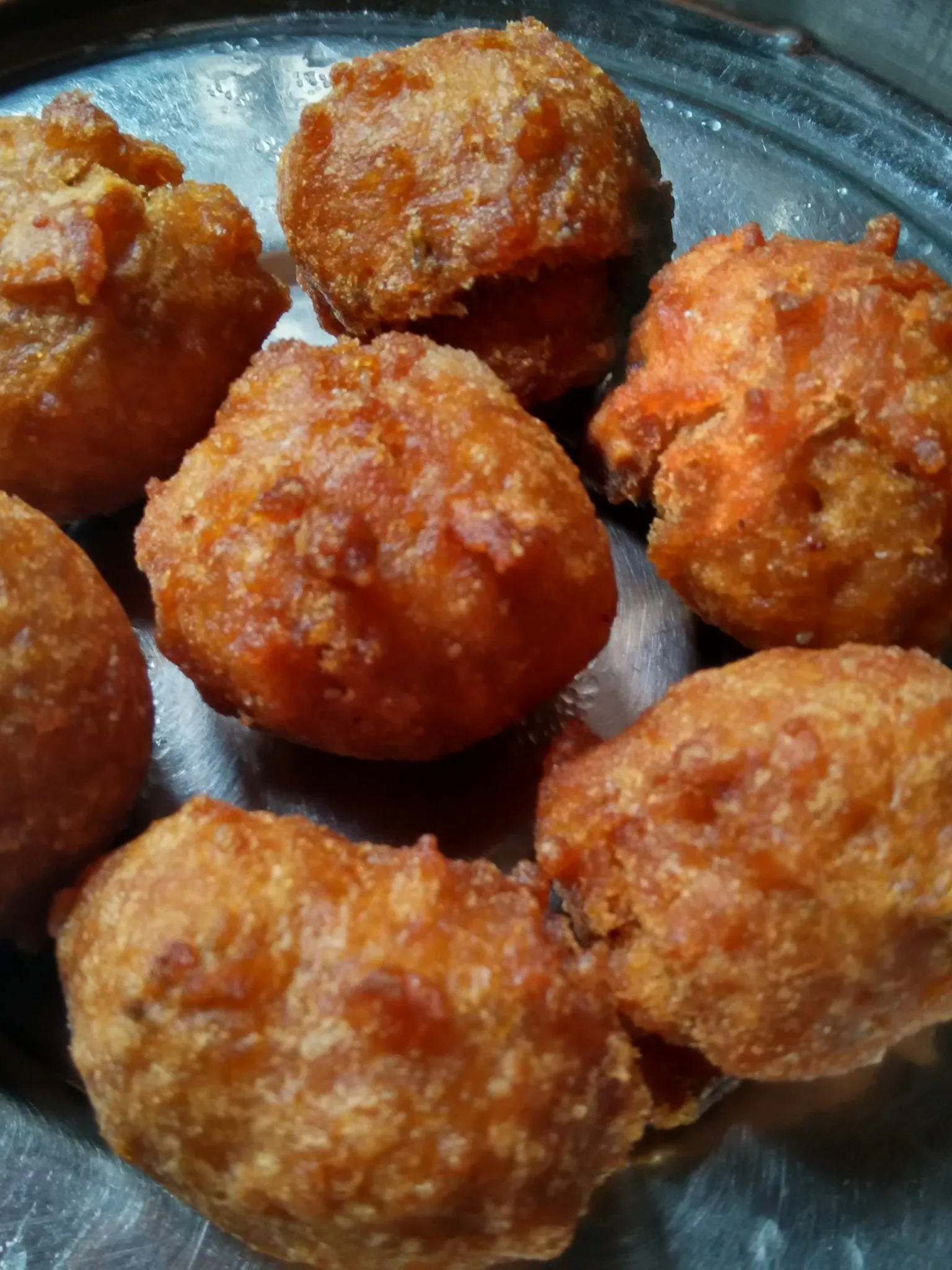 Gulgula: Golden fried blobs made with a batter of flour and brown sugar