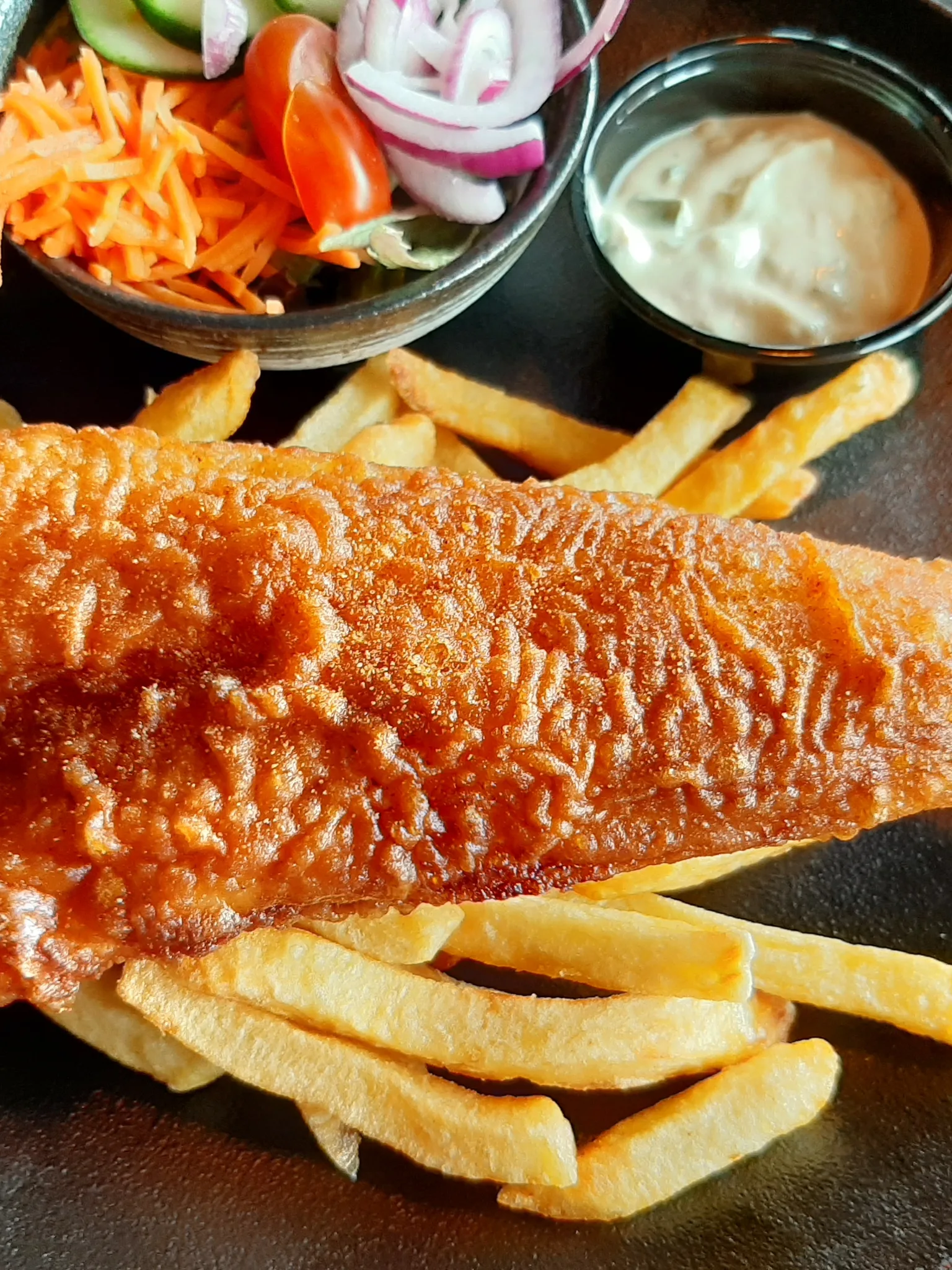 lekkerbekje: A traditional Dutch fish dish called lekkerbekje : originally a filet of cod fish in batter, deep fried, served with French fries, sauce and salad. It can also be served as a snack with sauce only