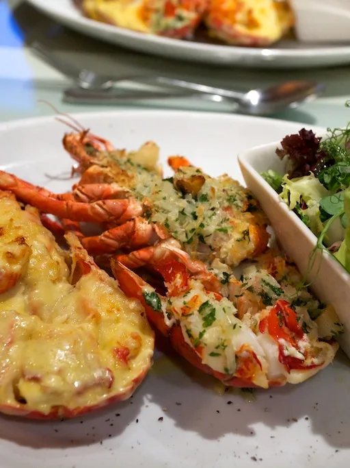 Lobster Thermidor: Lobster Thermidor (at the left of the plate)
