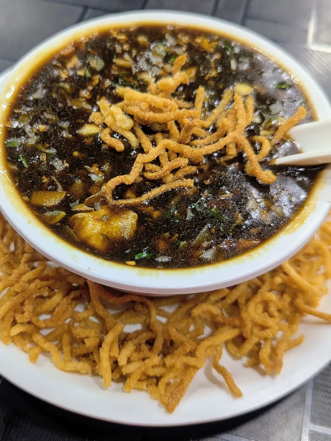 Manchow soup: A bowl of chicken Manchow soup with crispy-fried noodles