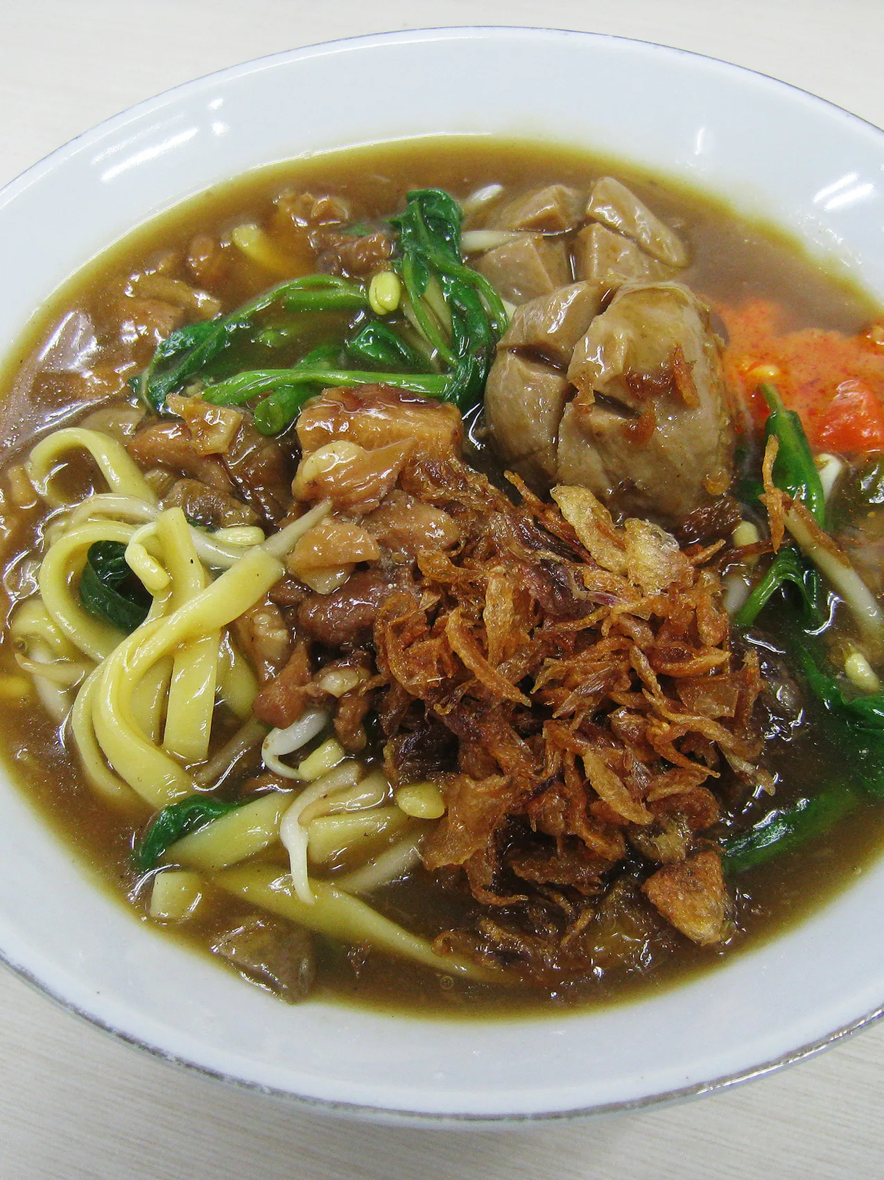 kale noodles: Mie Kangkung, or water spinach noodle with bakso (beef meatball) and spinkled with fried shallot. A Betawi dish served in Jakarta, Indonesia