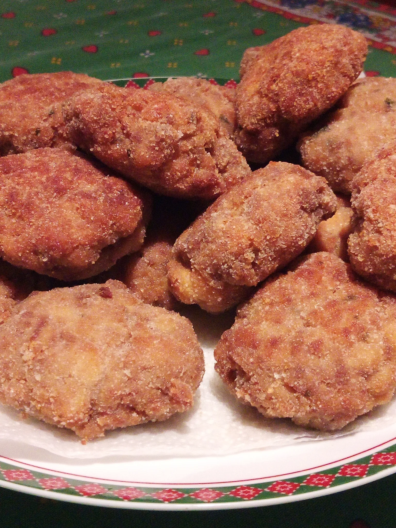 Mondeghili: Mondeghili, traditional fried beef and pork meatballs from Lombardy, Italy with thier typical form