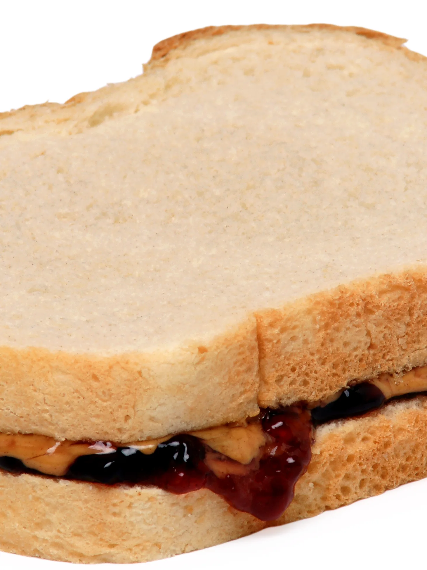 peanut butter and jelly sandwich: A peanut butter and jelly sandwich, made with Skippy peanut butter and Welch's grape jelly on white bread