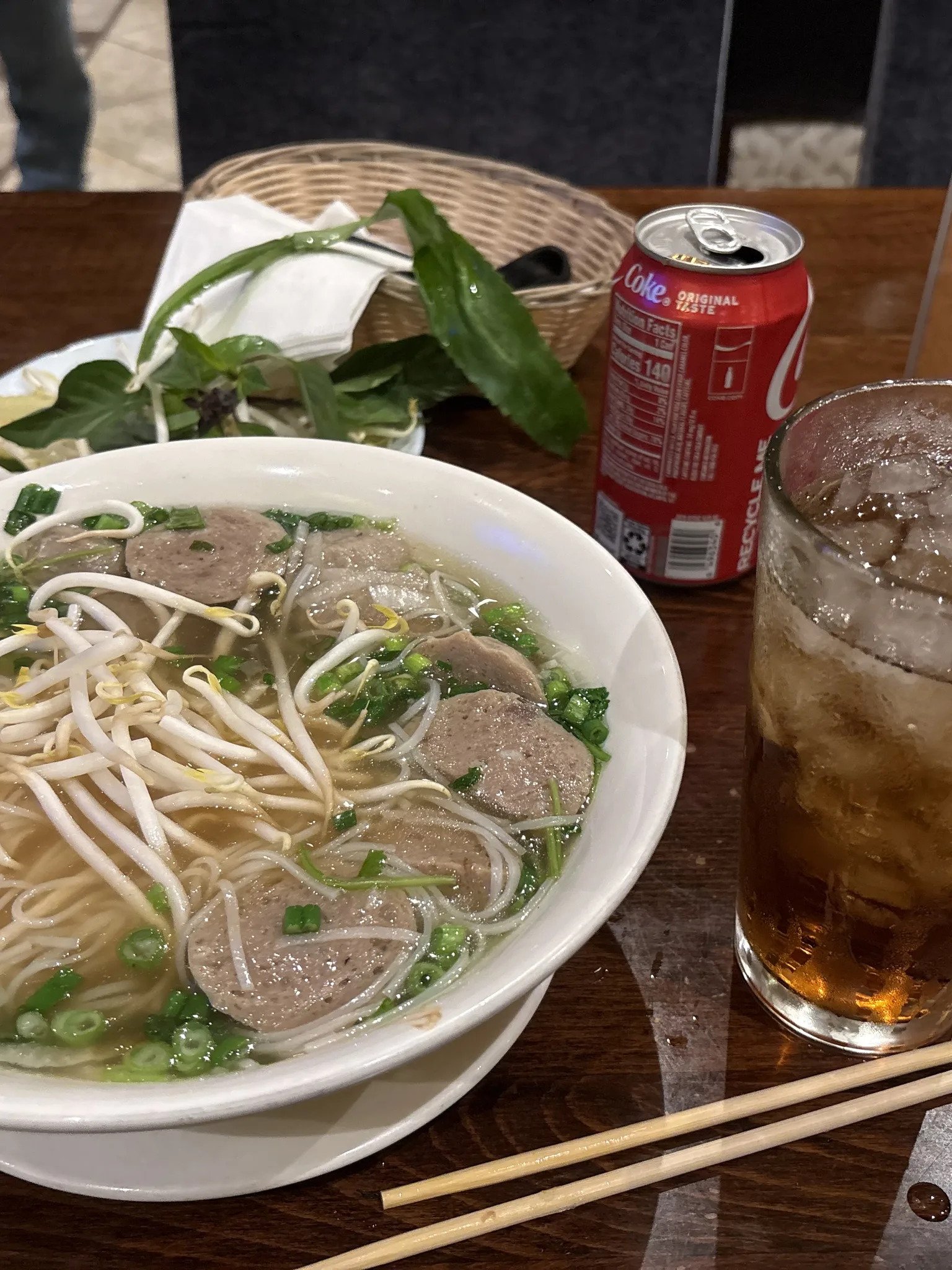 Phở: Bowl of Meatball Pho with a side a cold glass of coca-cola