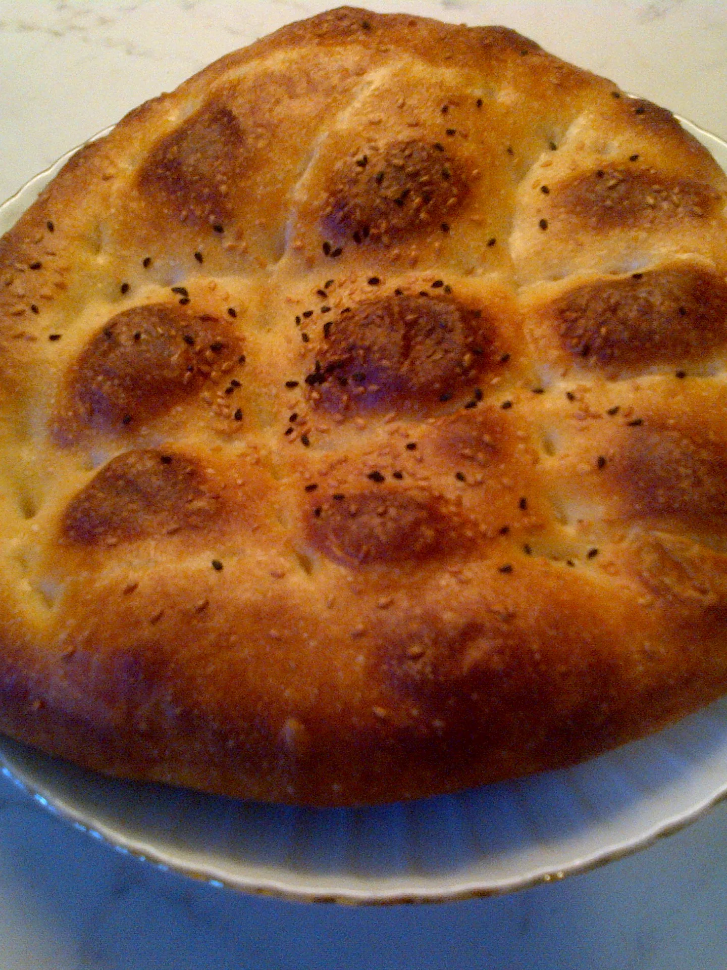 Ramadan pide: "Ramazan pidesi", not from a traditional bakery but put to oven in a supermarket. Ramadan 2016 in Turkey