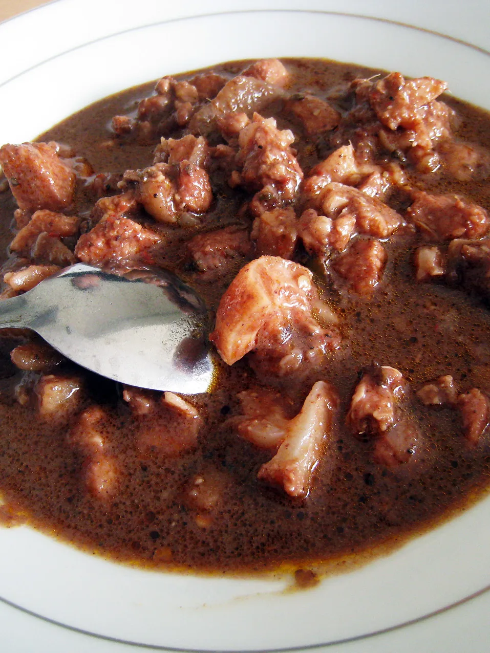 Sangsang: Batak cuisine, the saksang pork stew cooked in its blood and spices
