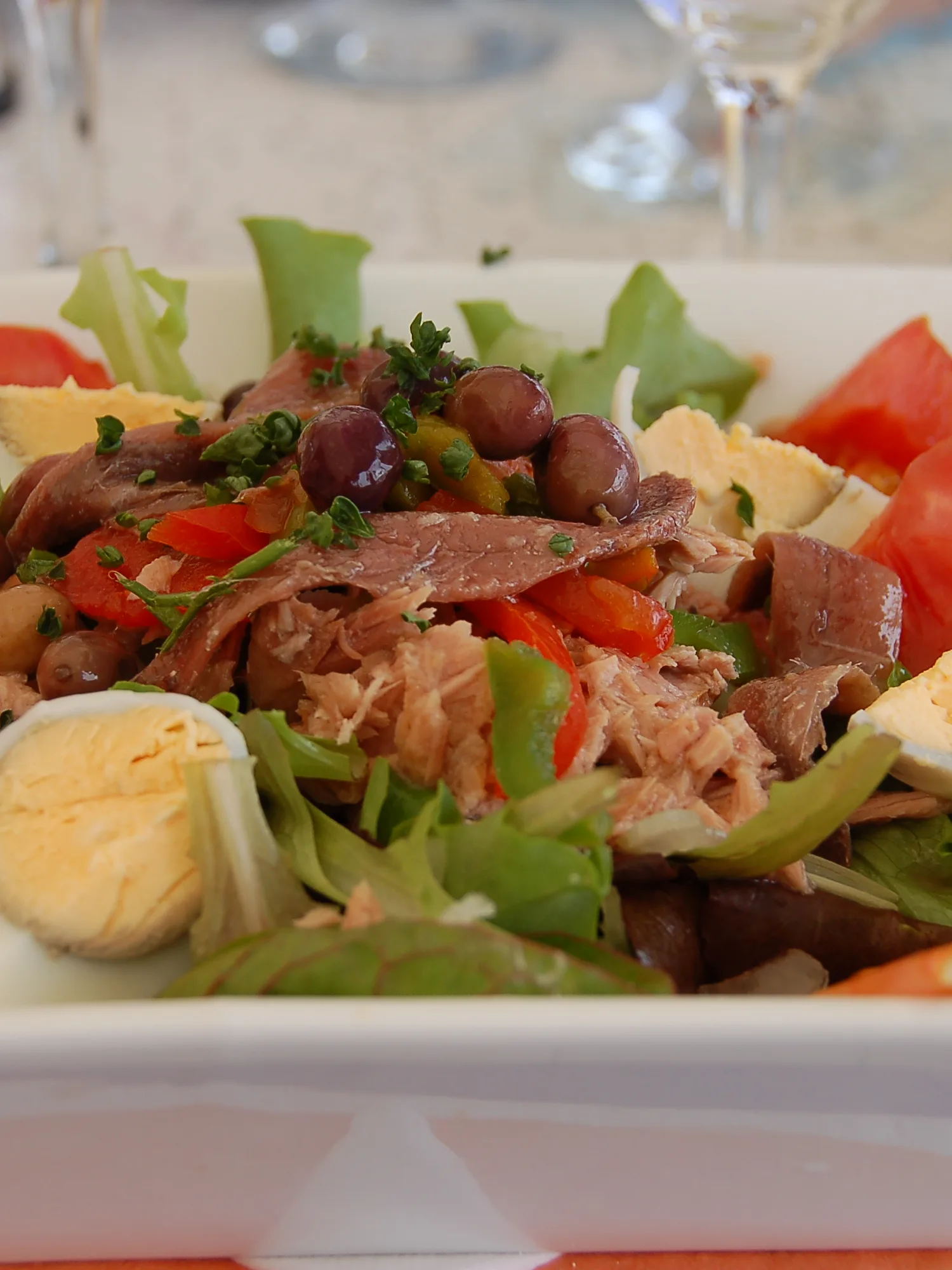 Niçard salad: A Salad Niçoise in a restaurant at the coast of the Mediterranean Sea in France