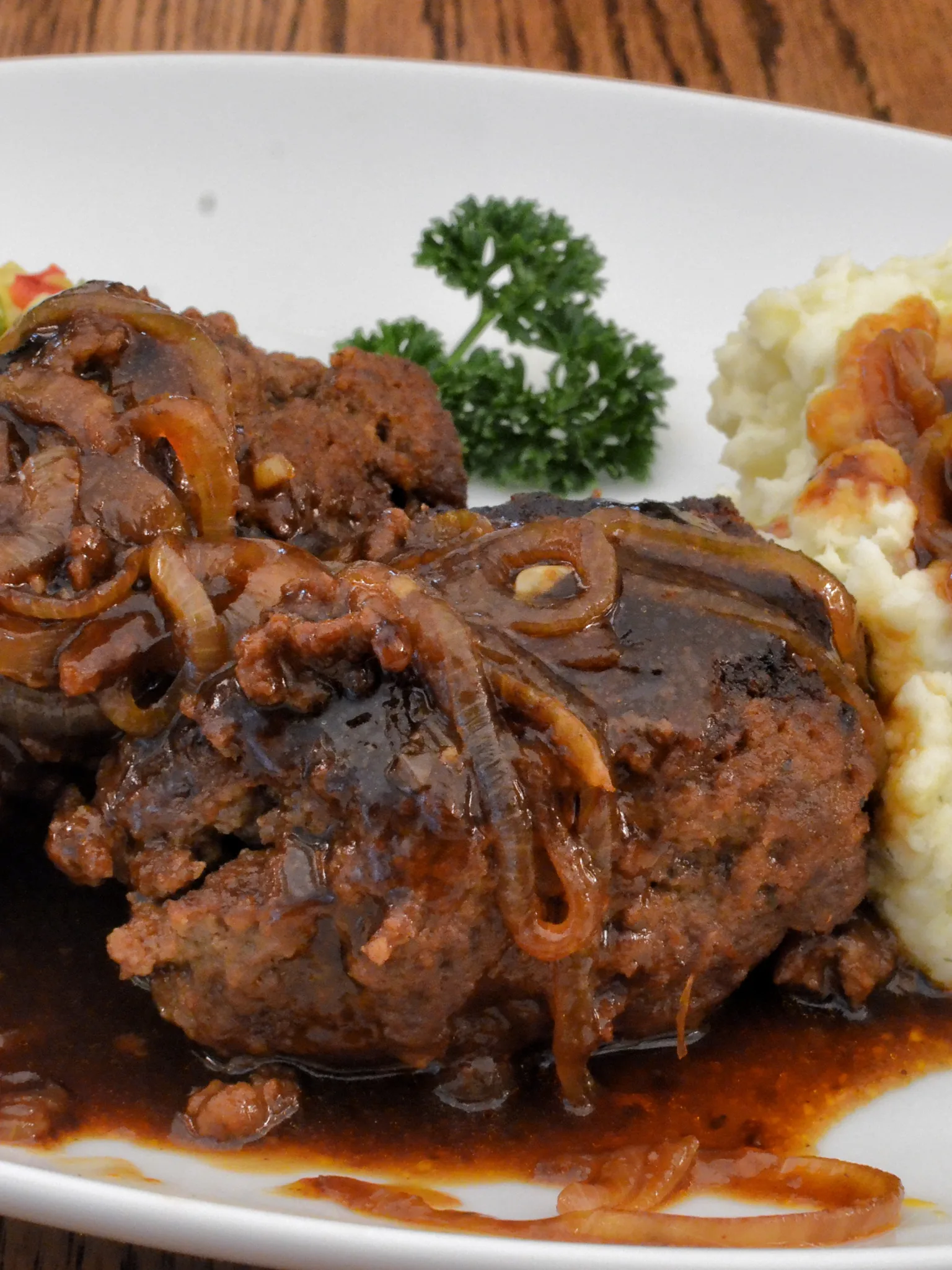 Salisbury steak: Two salisbury steaks with brown sauce