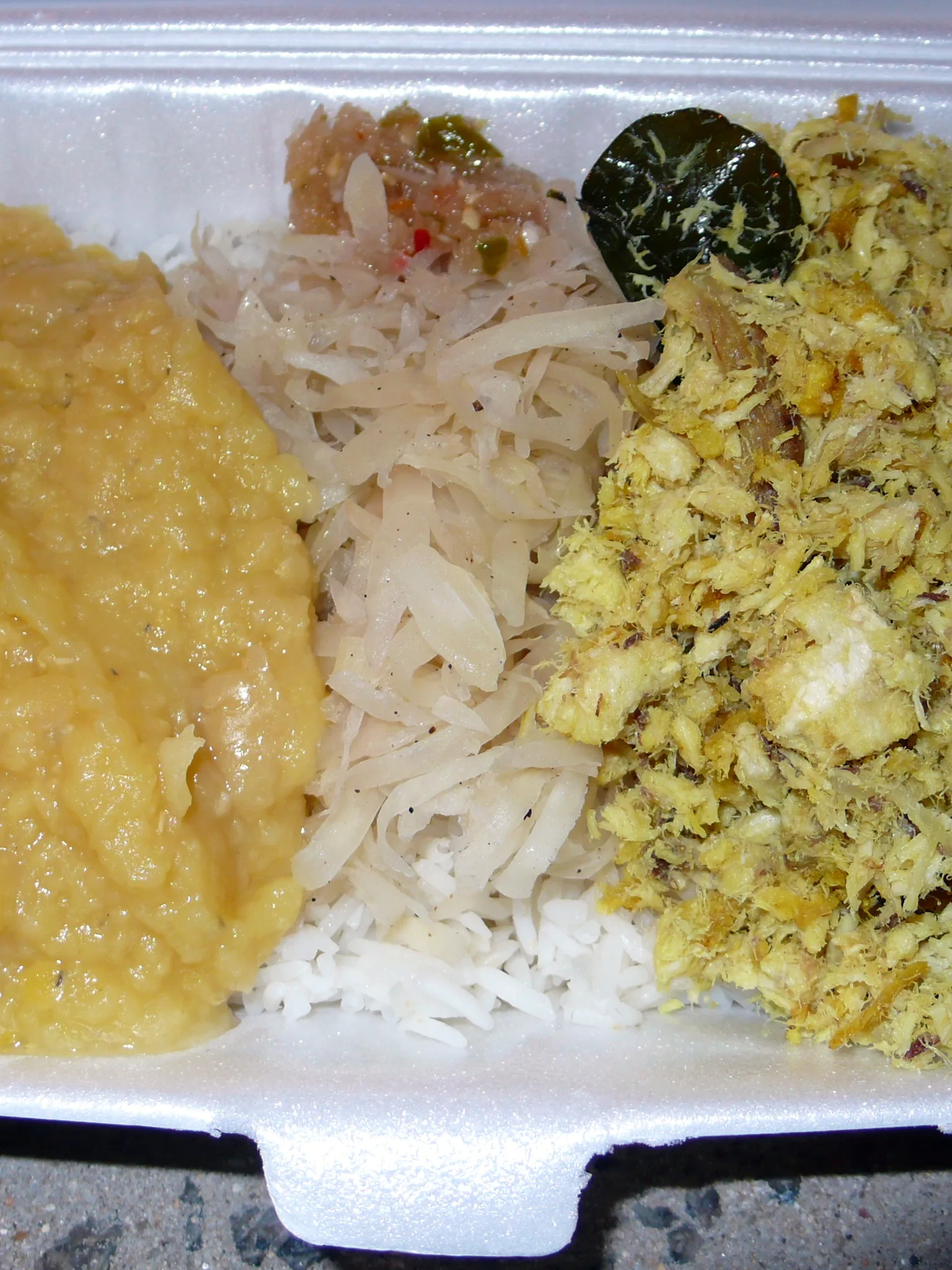 Shark chutney: Meal served in Mahé, Seychelles on October 20, 2010, consisting of shark chutney, lentils, and shredded green papaya on rice