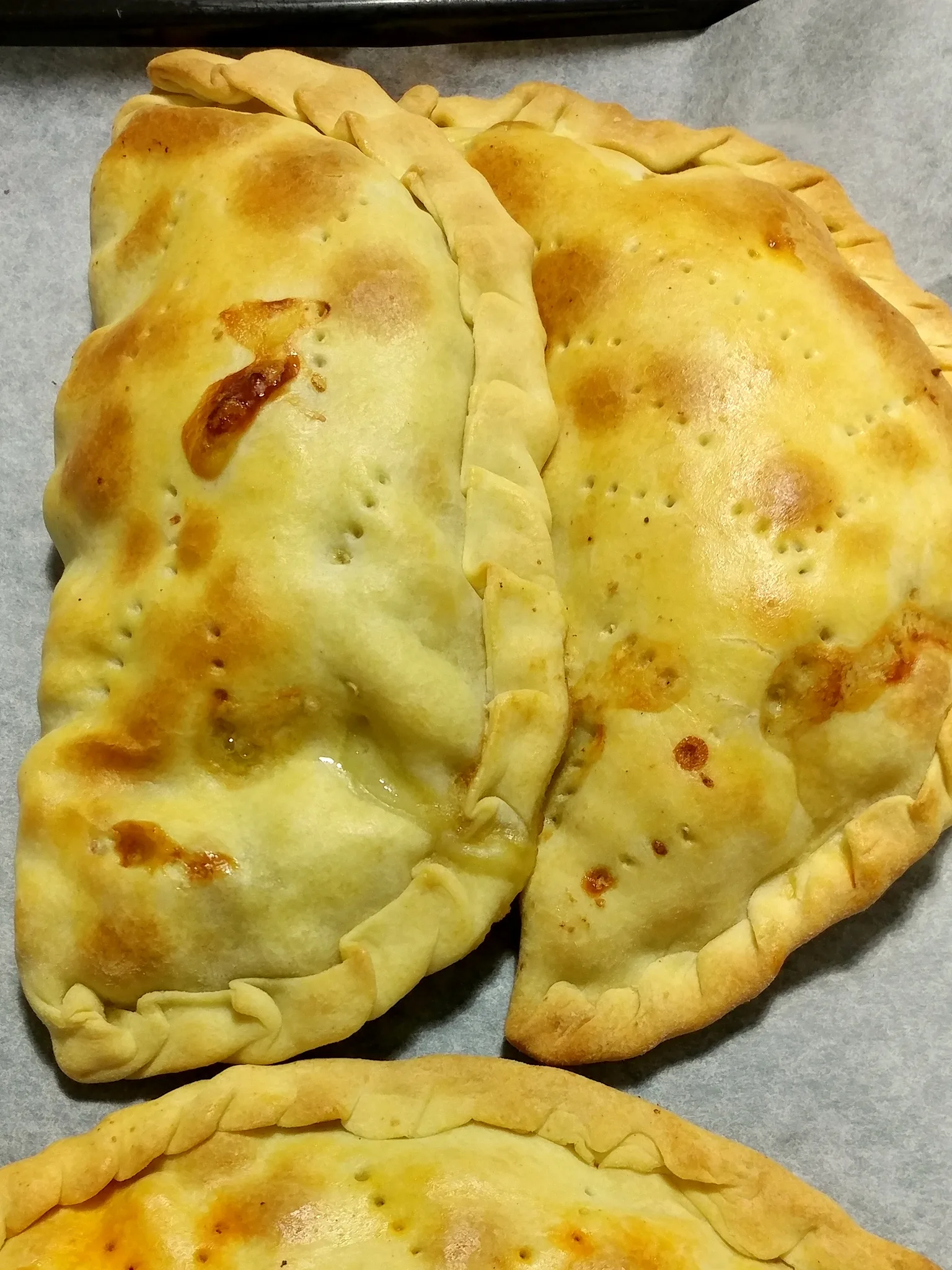 U' pastizz rtunnar PAT: half moon shaped baked good filled with minced meat from Rotondella, Italy