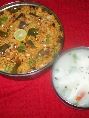 Vangibath: vangi bath/brinjal rice bath ,karnataka cusine,made withh ome made spice powder.i.e vangi bath masala,brinjal,masala mixed with cooked rice.served with curds,papad